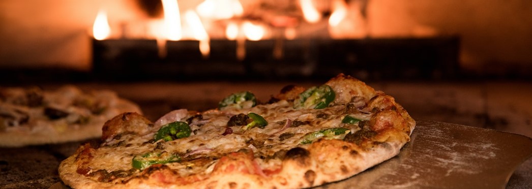 Baked Pizza On Pizza Peel In Oven 905847